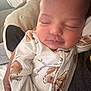 Delilah joined the competition — help win amazing prizes! baby, sleeping, infant, pajamas, person, adult, couch, relaxing, face, closeup, indoor, comfort, family, rest, soft, peaceful, cute, human, portrait, cozy