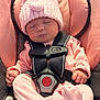 Delilah is registered to the contest to win money with this photo: baby, infant, sleeping, pink_hat, pom_pom, car_seat, safety_harness, pink_outfit, cozy, cute, child, newborn, soft_lighting, indoor, peaceful, closed_eyes, small_hands, footed_pajamas, knit_hat, seat