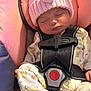 Delilah is registered to the contest to win money with this photo: baby, sleeping, car_seat, pink_hat, knit_hat, pom_pom, onesie, animal_print, socks, striped_socks, harness, child, infant, cute, peaceful, indoors, soft_lighting, close_up, seat, resting