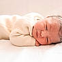 Delilah is registered to the contest to win money with this photo: newborn, baby, infant, sleeping, cozy, knitwear, cream, soft, peaceful, resting, cute, portrait, child, toddler, person, indoors, bed, blanket, relaxed, face