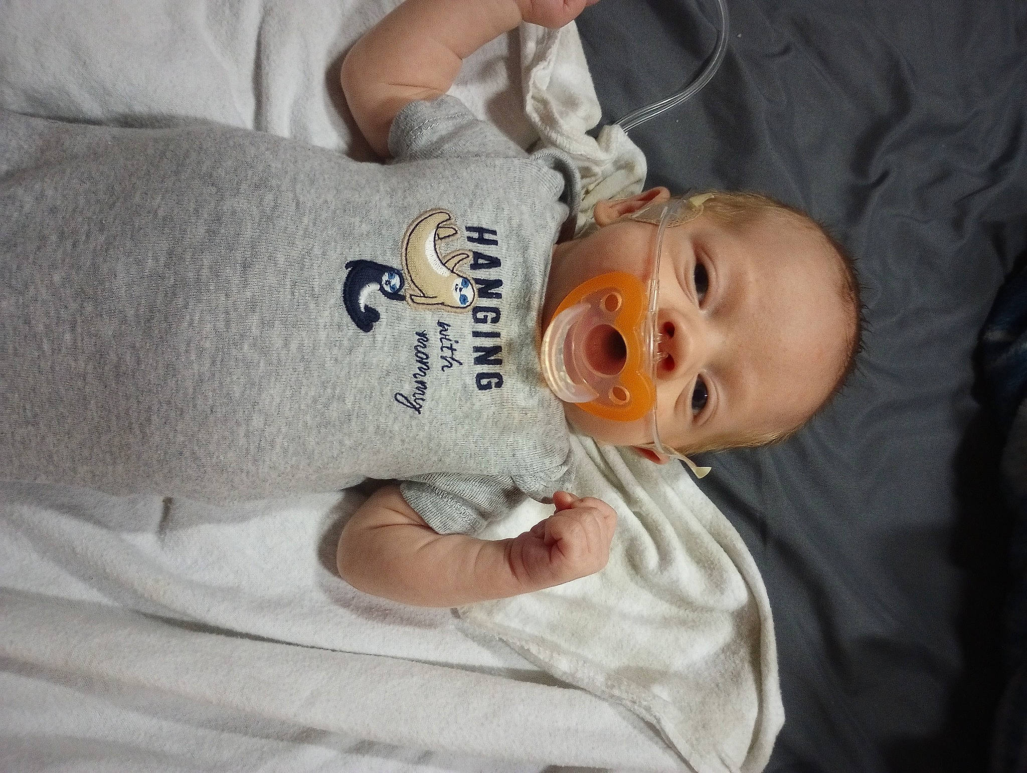 Ivan is registered to the contest to win money with this photo: arm, baby, baby_products, baby_toddler_clothing, cheek, child, comfort, ear, elbow, eyelash, finger, hand, happy, hat, nose, person, skin, sleeve, smile, toddler