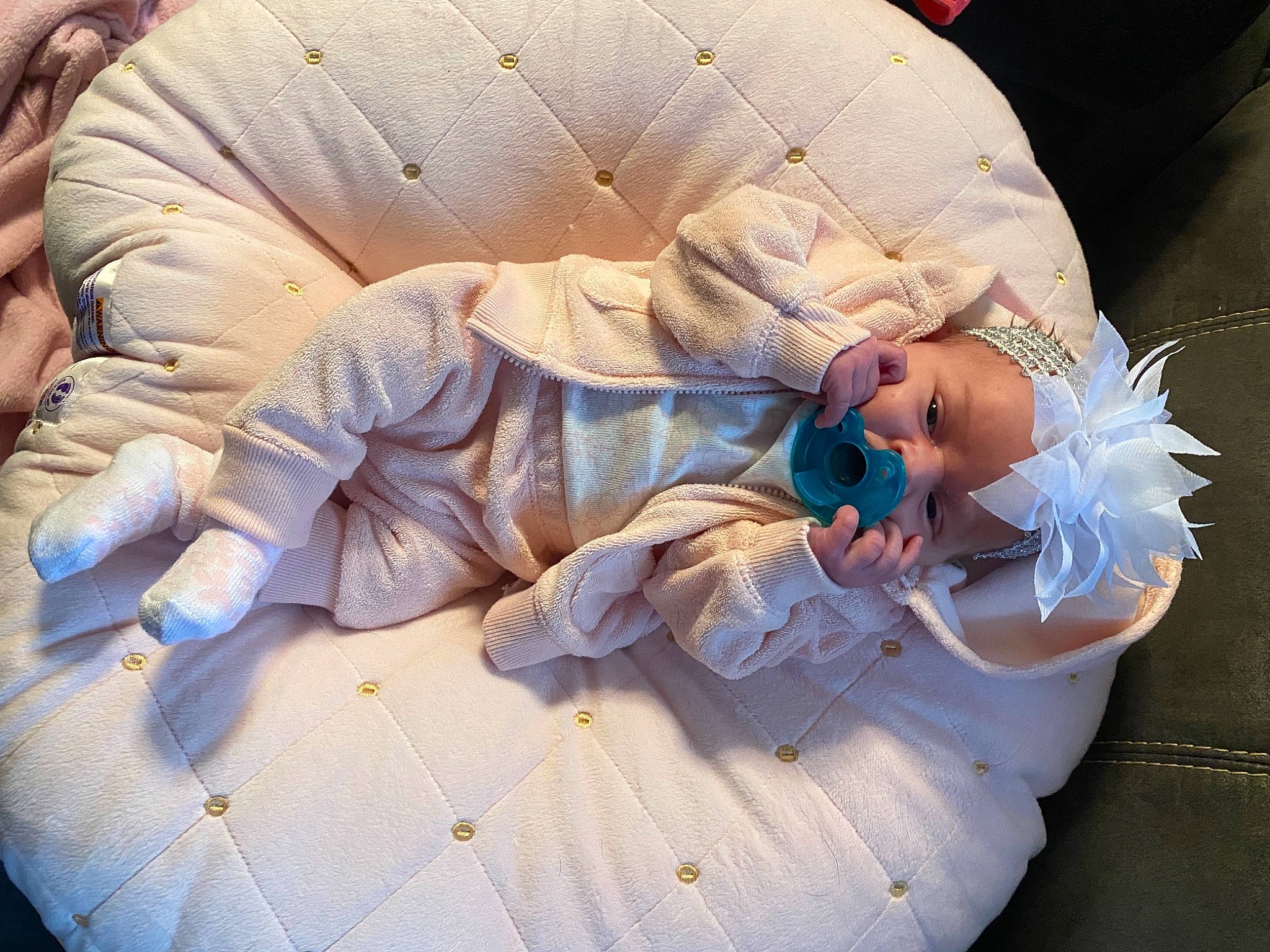Jersey is registered to the contest to win money with this photo: baby_products, child, comfort, costume, fashion_accessory, flesh, human_leg, linens, nap, peach, person, petal, sitting, sleep, wood