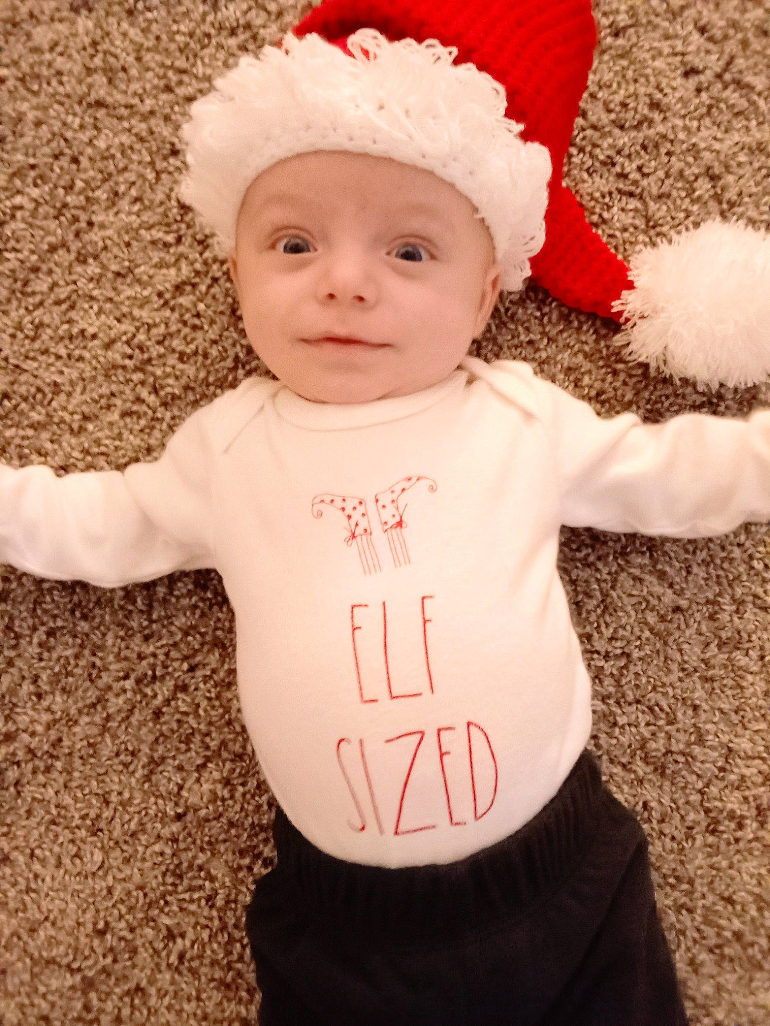 Sawyer Ryan is registered to the contest to win money with this photo: baby, baby_toddler_clothing, cap, child, costume_hat, event, face, facial_expression, happy, hat, headgear, headwear, holiday, knit_cap, outerwear, pattern, person, pink, sleeve, smile