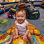 toddler, child, smiling, playground, indoor, mall, toy, sculpture, turtle, colorful, people, seating, floor, clothing, happy, person, play, fun, cute, baby