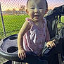baby, chain_link_fence, child, cute, evening, grass, green_field, hand, happy, nature, outdoor, park, person, pink_dress, portrait, seat, smiling, stroller, sunset, toddler