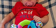 Penelope is registered to the contest to win money with this photo: american_flag_pattern, baby, blanket, blue_clothing, celebration, child, colorful, cozy, cute, holiday_outfit, indoor, infant, lying_down, pacifier, patterned, person, plush_toy, portrait, red_clothing, small_hand
