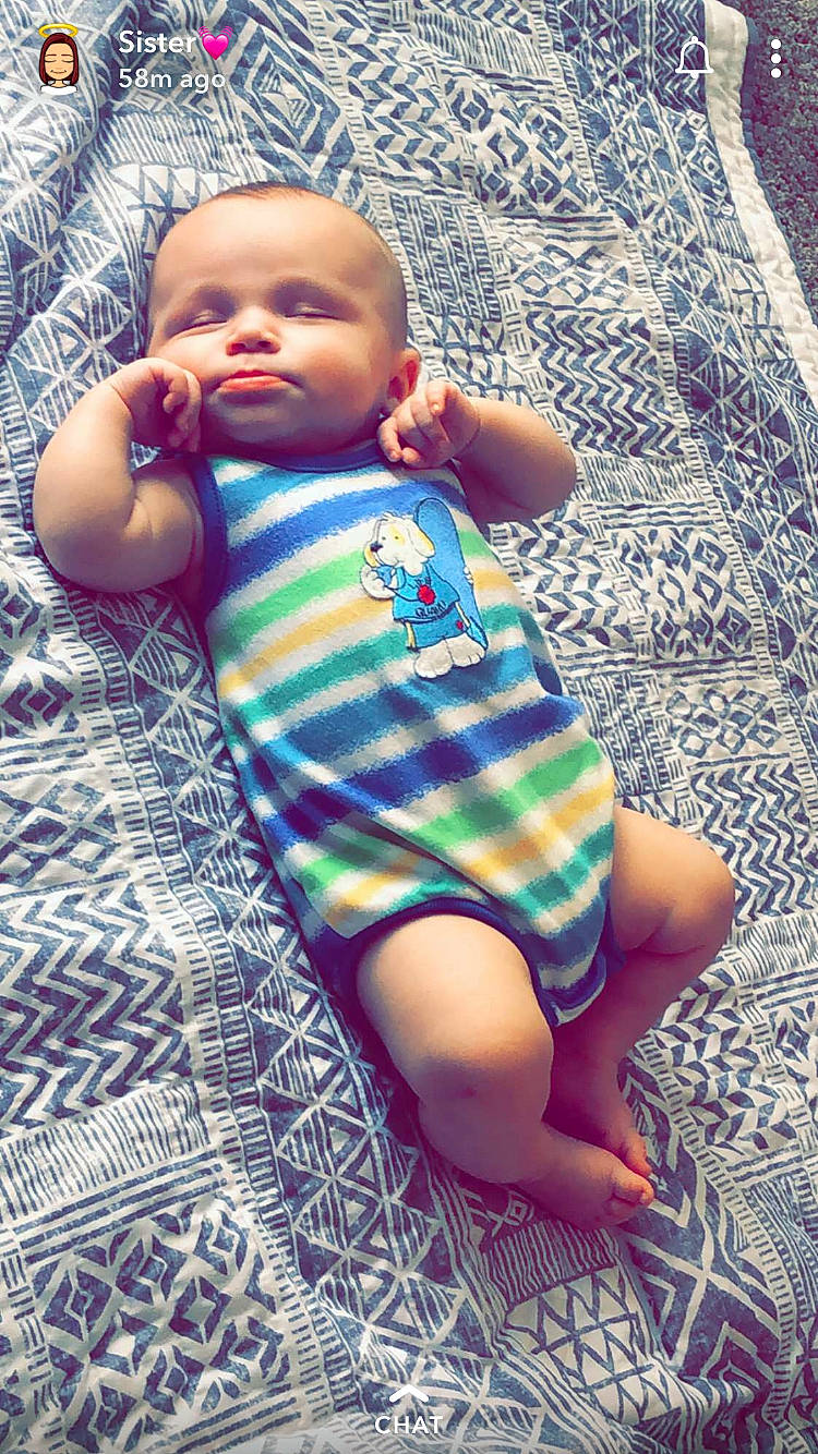 Keelan is registered to the contest to win money with this photo: baby, baby_toddler_clothing, cheek, child, leg, nose, pattern, person, sitting, skin, smile, toddler