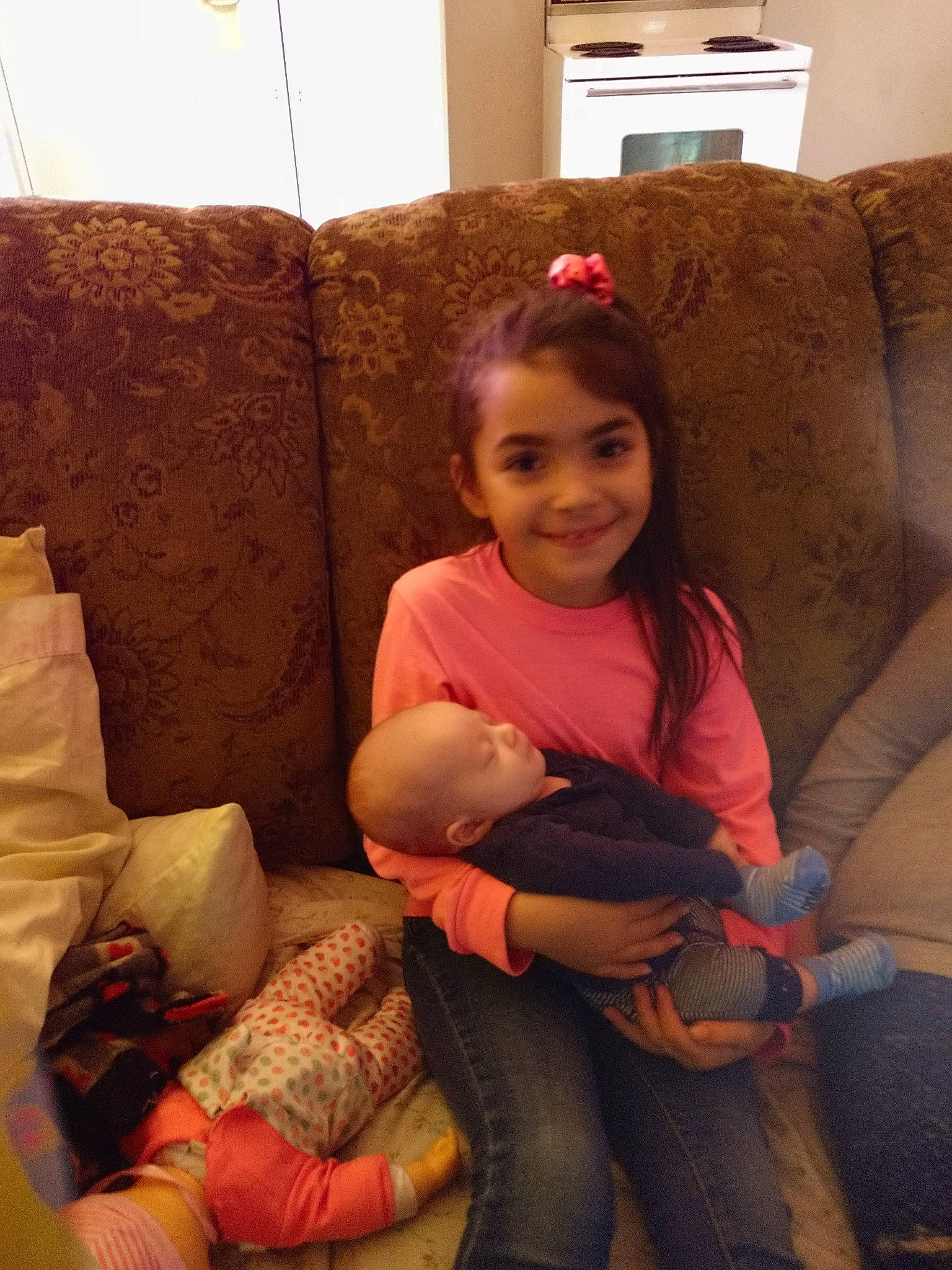 Layla is registered to the contest to win money with this photo: arm, child, comfort, couch, joy, leg, person, sitting, toddler