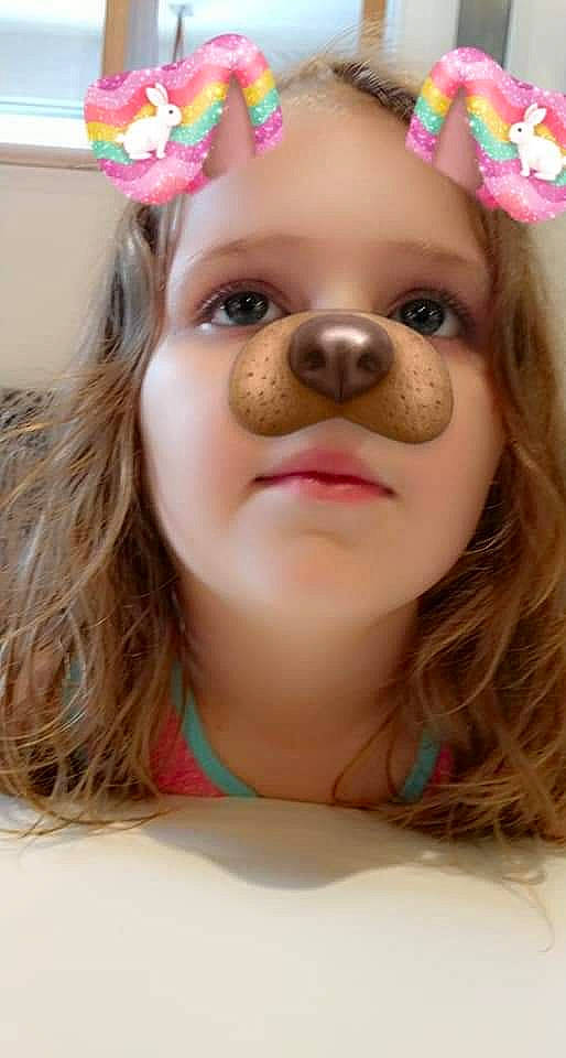 Jojo is registered to the contest to win money with this photo: brown_hair, canidae, cheek, child, ear, eye, eyebrow, eyelash, face, fawn, hair, hair_accessory, head, lip, nose, person, pink, skin