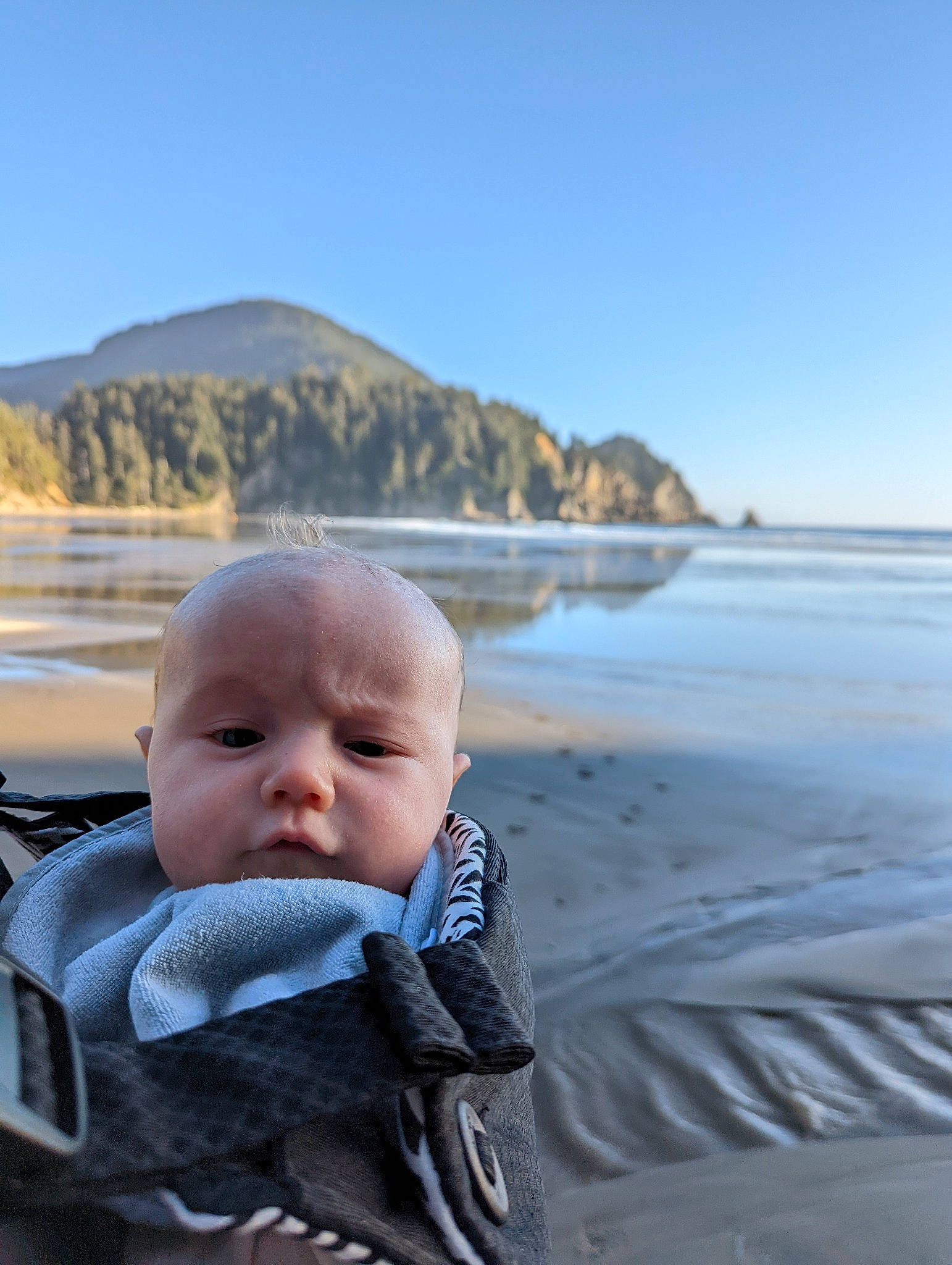 Sterling is registered to the contest to win money with this photo: baby, beach, cloud, coastal_and_oceanic_landforms, fun, happy, horizon, lake, leisure, mountain, people_in_nature, person, sand, shore, sky, toddler, travel, tree, water, wind_wave