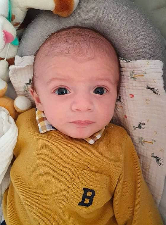 Ezio participe au concours pour gagner de l'argent avec cette photo : baby, baby_products, baby_toddler_clothing, cheek, child, eye, eyebrow, eyelash, face, head, iris, linens, lip, mouth, nose, person, skin, sleeve, stuffed_toy, toddler