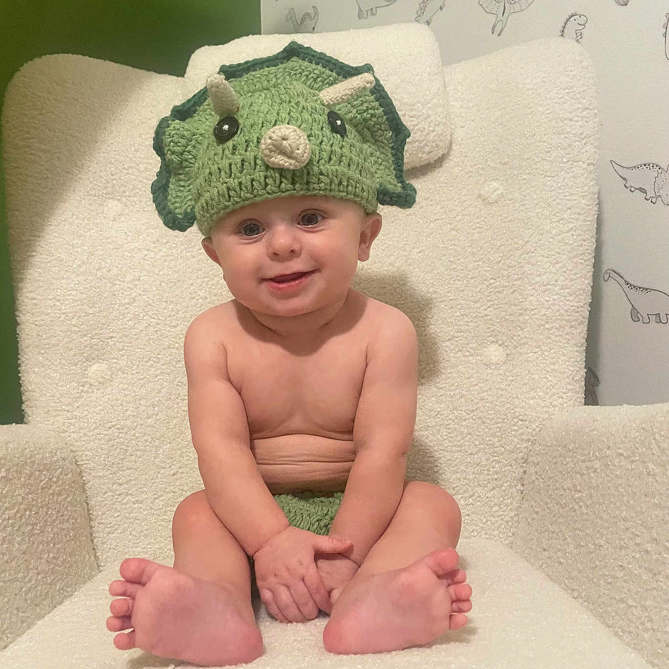 Lucas is registered to the contest to win money with this photo: baby, beanie, bodypart, bonnet, cap, chair, clothing, cushion, face, finger, furniture, hand, hat, head, homedecor, newborn, person, photography, portrait, sitting