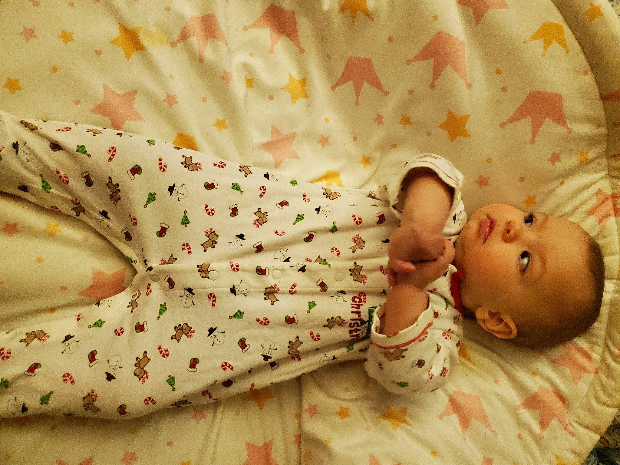 Ember is registered to the contest to win money with this photo: baby, baby_products, baby_safety, baby_sleeping, baby_toddler_clothing, bedding, child, comfort, dress, facial_expression, happy, linens, pattern, people_in_nature, person, petal, plant, skin, sleeve, textile