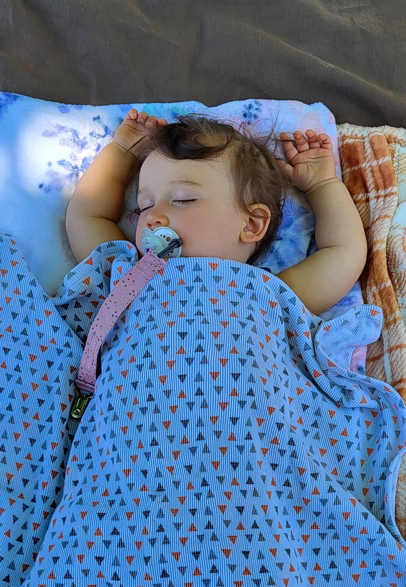 Abigail joined the competition — help win amazing prizes! azure, baby, baby_toddler_clothing, bedding, bedtime, blanket, blue, child, comfort, electric_blue, eyelash, grass, linens, pattern, person, sitting, skin, sleeve, textile, toddler