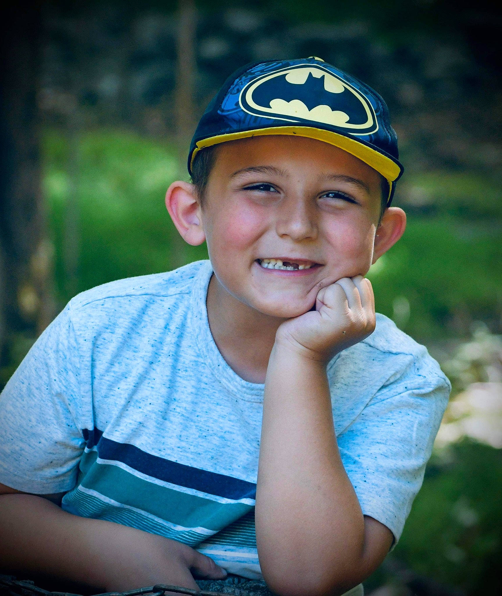 Brycen is registered to the contest to win money with this photo: baseball_cap, beauty, cap, child, electric_blue, eye, flash_photography, fun, grass, happy, hat, headwear, joy, leisure, people_in_nature, person, personal_protective_equipment, recreation, smile, sports_gear