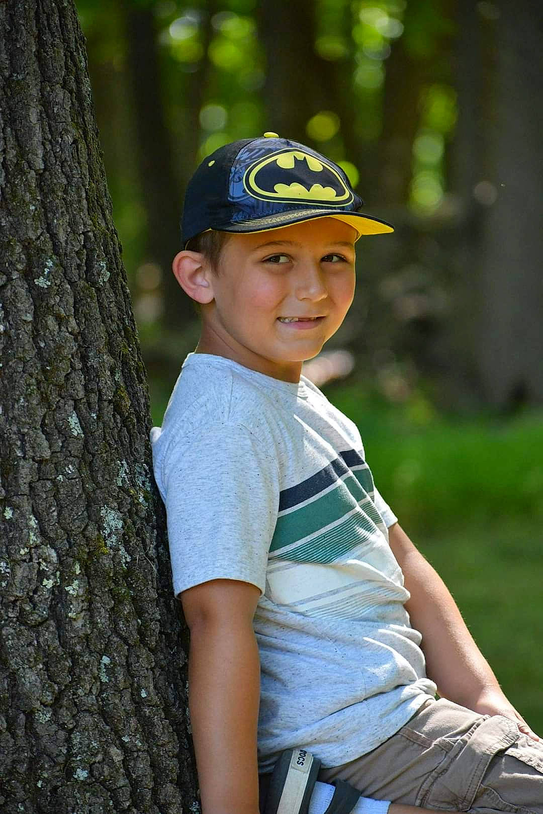 Brycen is registered to the contest to win money with this photo: arm, baseball_cap, cap, elbow, electric_blue, eye, flash_photography, fun, grass, happy, head, headwear, joy, leisure, people_in_nature, person, plant, recreation, sleeve, smile