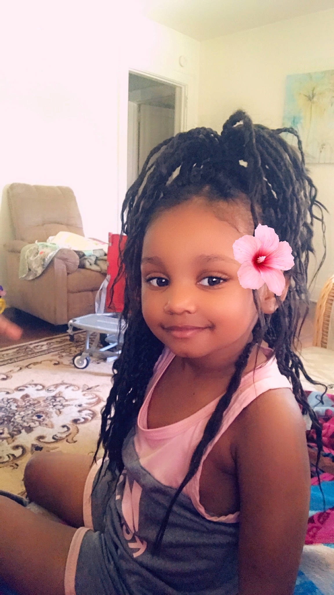 Aubrie is registered to the contest to win money with this photo: beauty, black_hair, brown_hair, cheek, child, ear, face, fashion_accessory, forehead, hair, hair_accessory, hair_coloring, hairstyle, head, joy, long_hair, person, pink, selfie, toddler