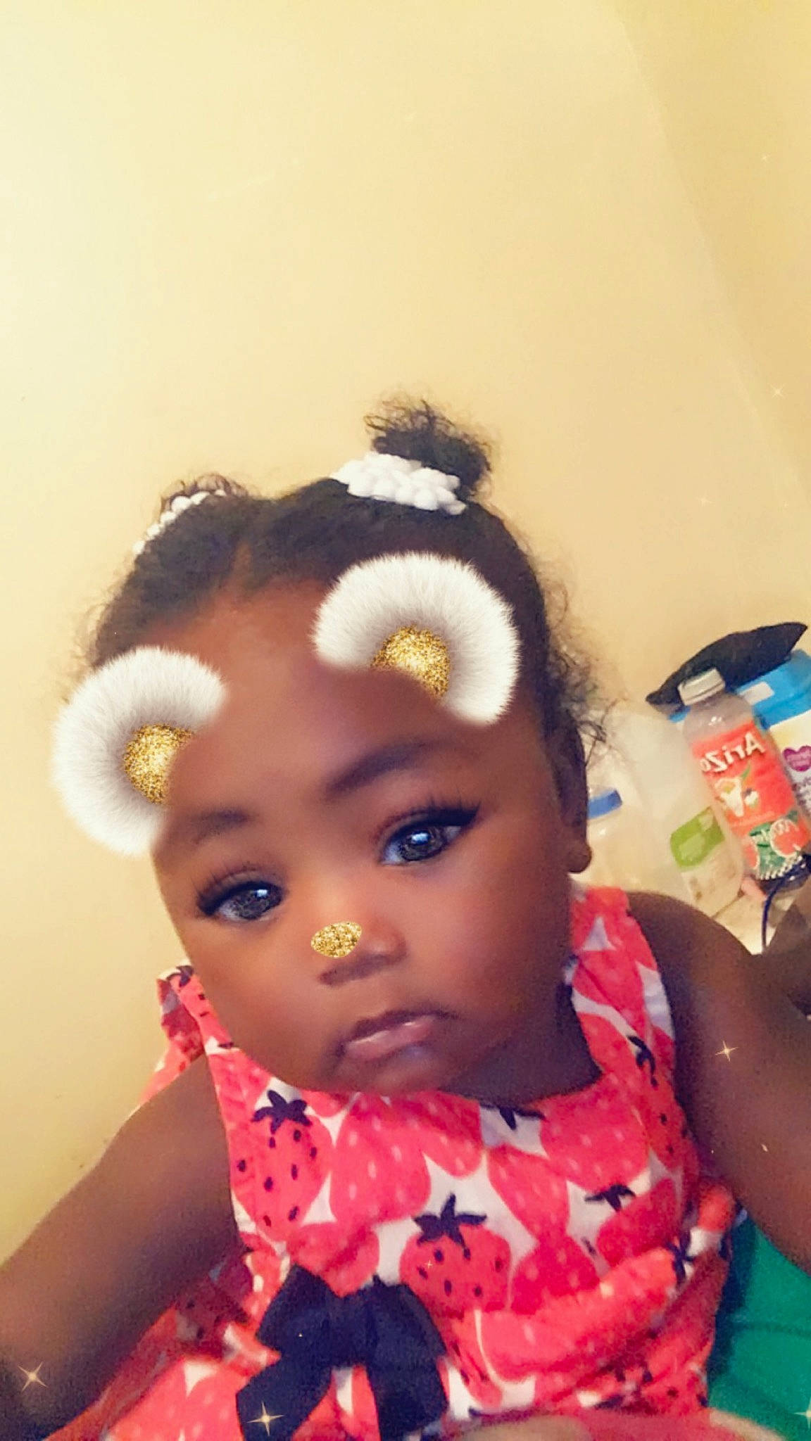 Aniyah is registered to the contest to win money with this photo: black_hair, cheek, child, ear, eyelash, forehead, hair, hair_accessory, hairstyle, head, lip, nose, person, toddler, toy
