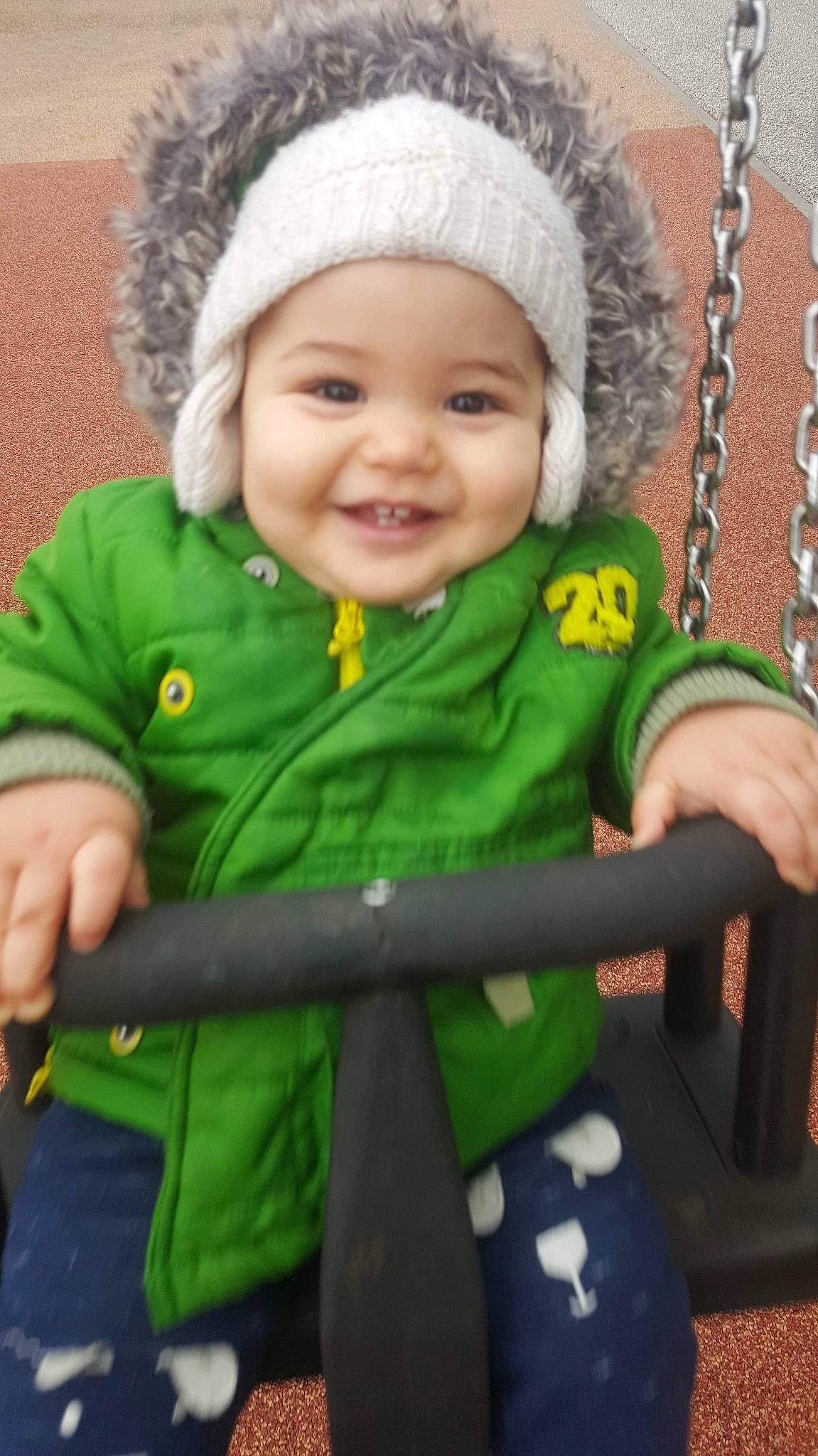 Islam participe au concours pour gagner de l'argent avec cette photo : arm, baby_toddler_clothing, cheek, chin, eye, face, facial_expression, green, hand, happy, head, headwear, human_body, joy, organ, outerwear, person, photograph, product, skin