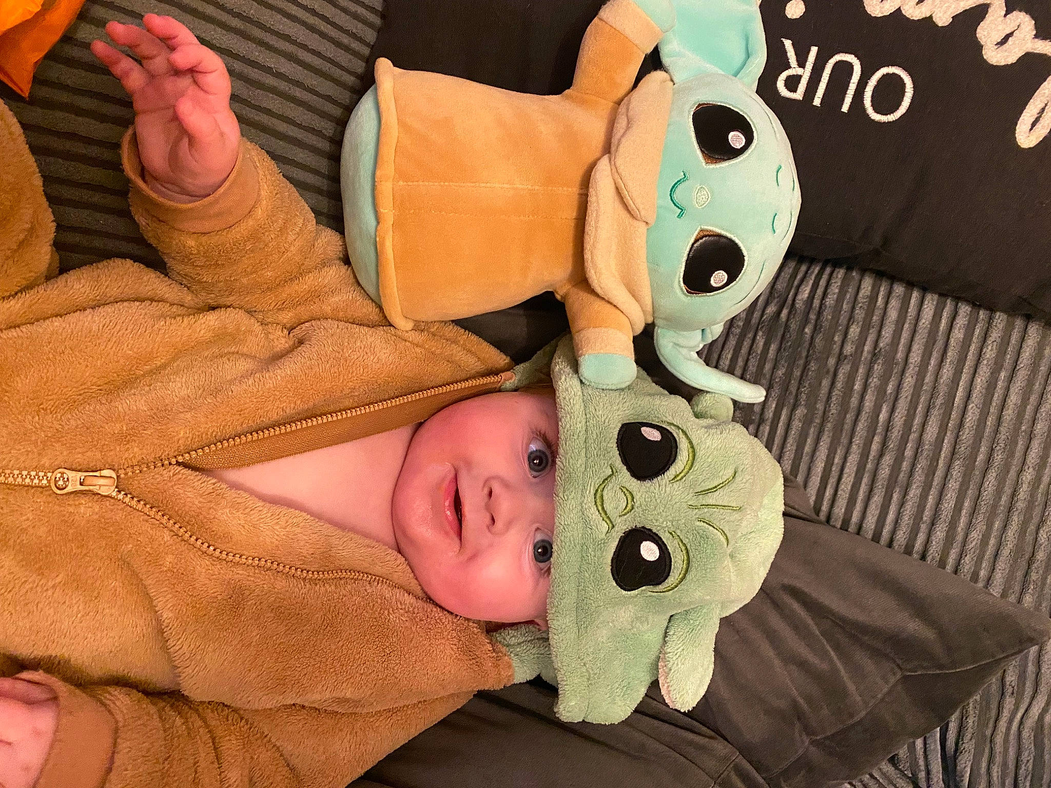 Oscar is registered to the contest to win money with this photo: art, baby, baby_products, baby_toddler_clothing, cheek, child, comfort, finger, gesture, hand, happy, headwear, linens, nail, person, stuffed_toy, textile, thumb, toddler, toy