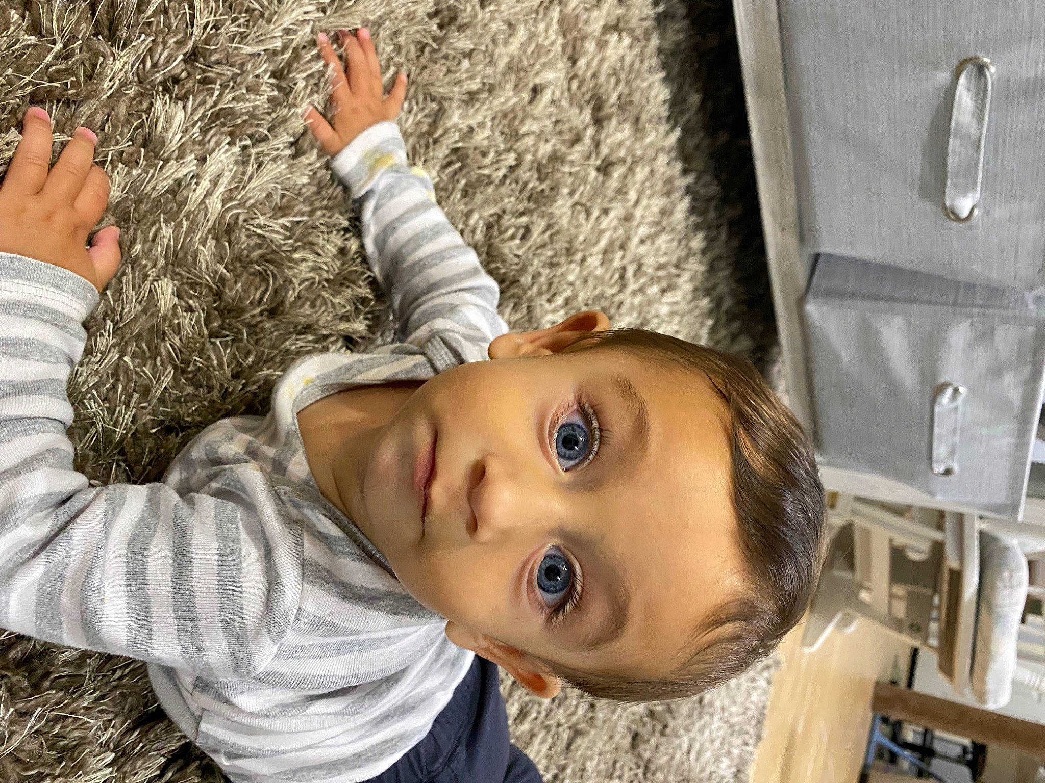 Leighton is registered to the contest to win money with this photo: child, fun, fur, gesture, grass, happy, leisure, person, plant, portrait_photography, sitting, skin, toddler, tree, vacation, wall, wood