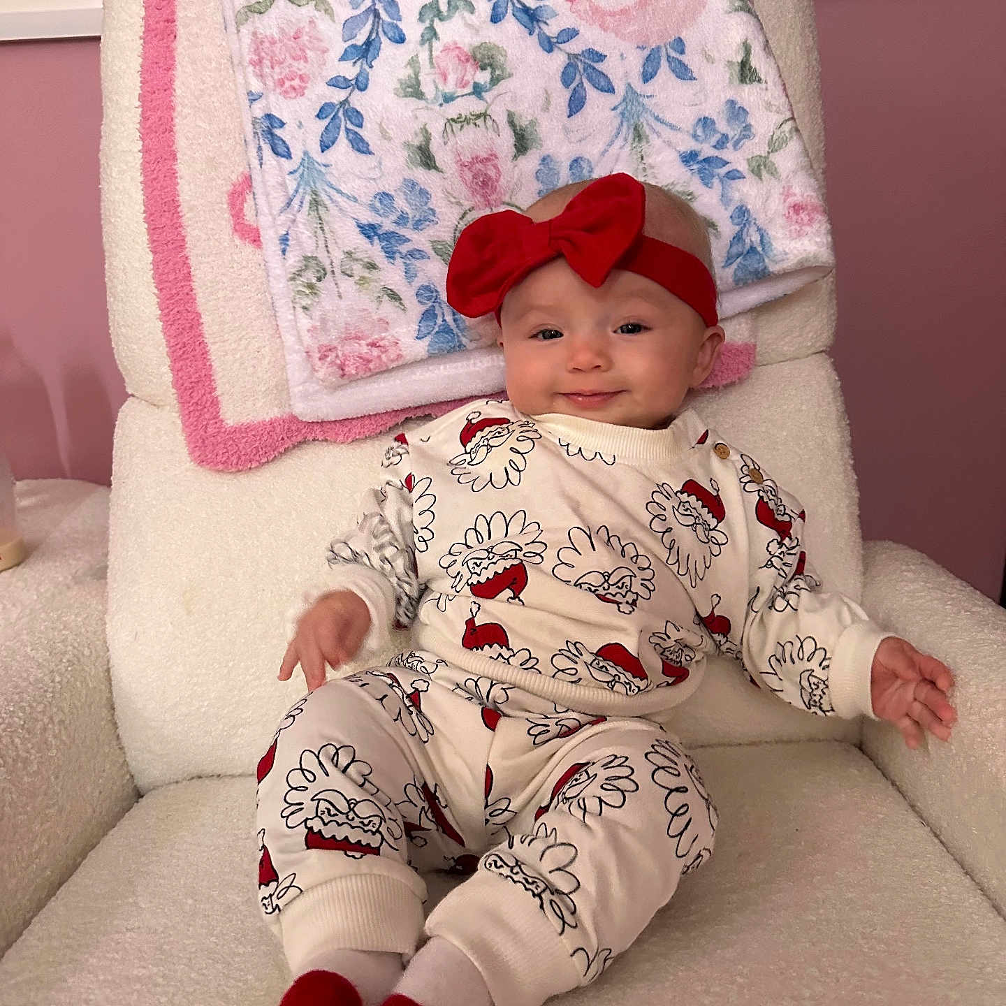 Aynsley joined the competition — help win amazing prizes! armchair, baby, blanket, child, cozy, cute, floral_pattern, furniture, happy, headband, holiday_theme, indoors, infant, pajamas, person, pink_wall, portrait, red_bow, smile, socks