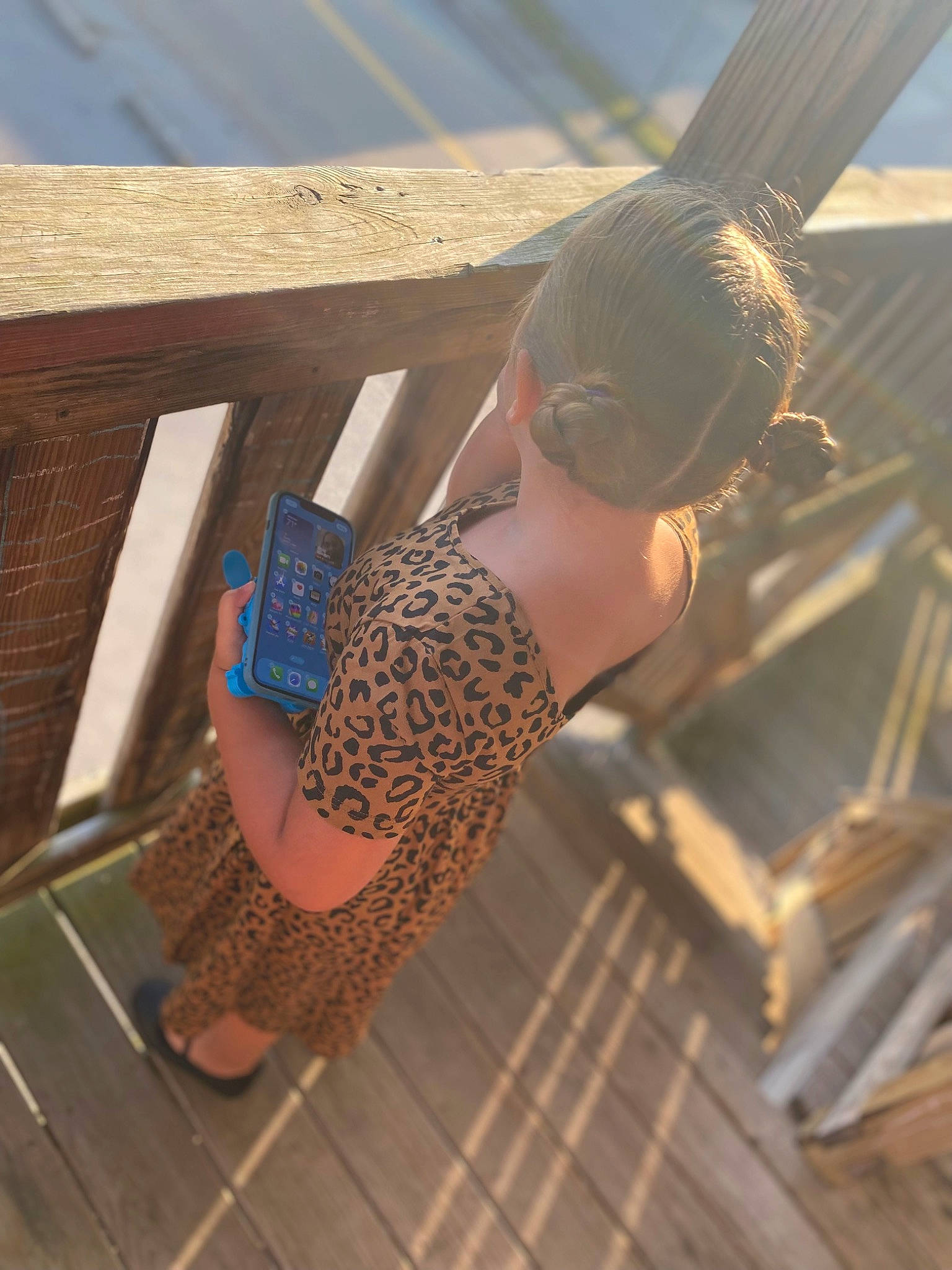 Gracie-ann joined the competition — help win amazing prizes! abdomen, barefoot, elbow, eyewear, flooring, foot, fun, hardwood, human_leg, leg, leisure, ocean, pattern, person, sandal, sitting, sunglasses, thigh, toe, waist