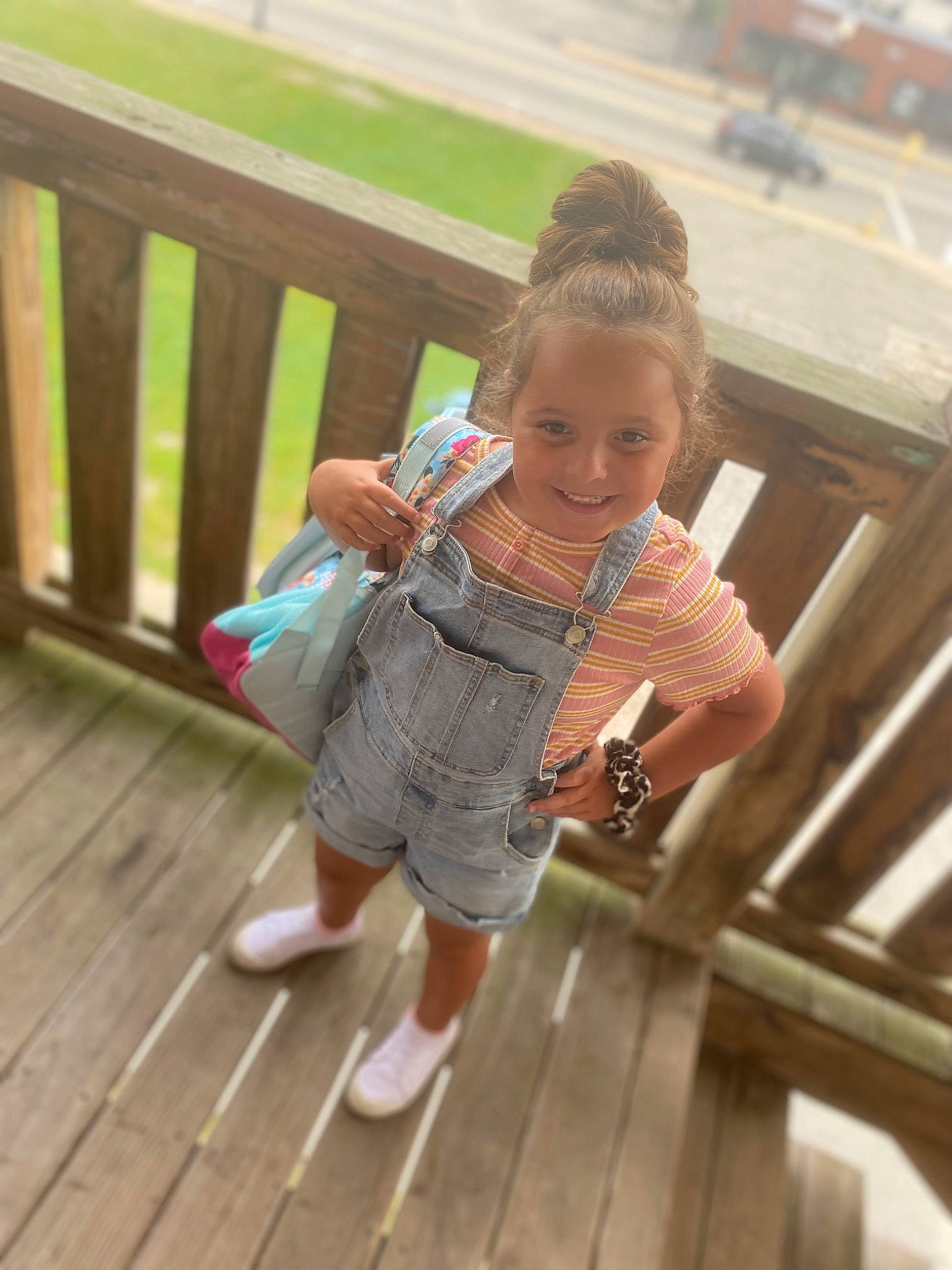 Gracie-ann is registered to the contest to win money with this photo: child, fence, flooring, fun, happy, hardwood, human_leg, joy, leg, leisure, person, recreation, sitting, skin, smile, sock, thigh, toddler, travel, waist
