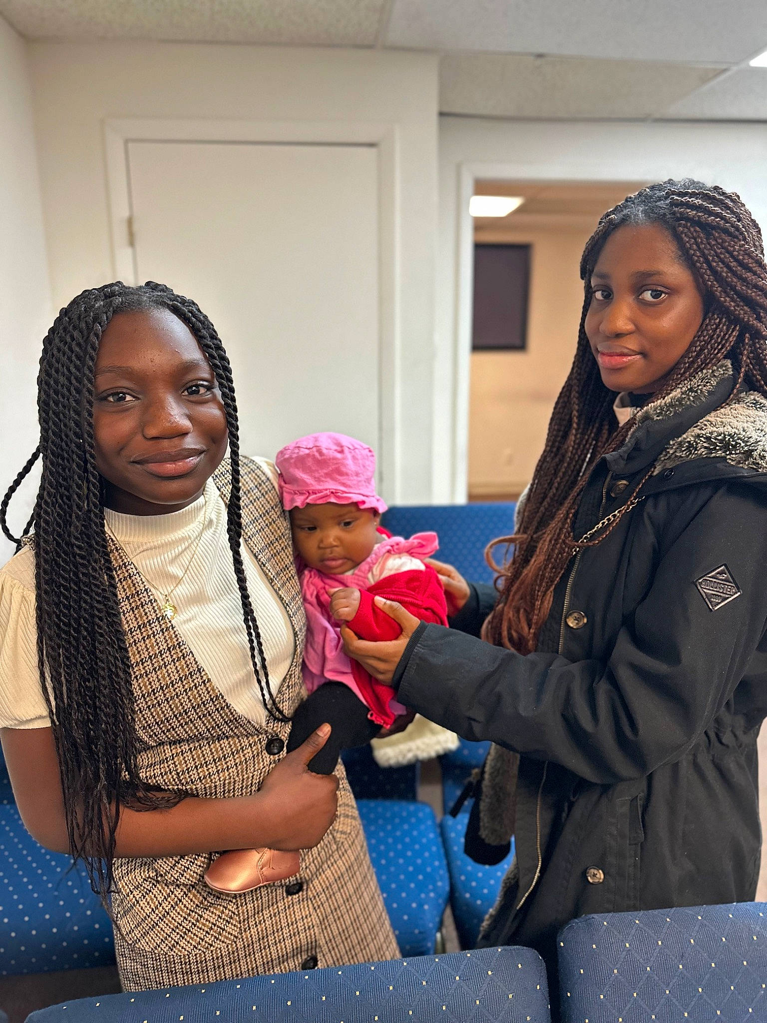 Lenora is registered to the contest to win money with this photo: baby, bag, child, comfort, conversation, cornrows, event, fashion_design, fun, happy, headgear, headwear, interaction, jewellery, joy, leisure, luggage_and_bags, magenta, person, room