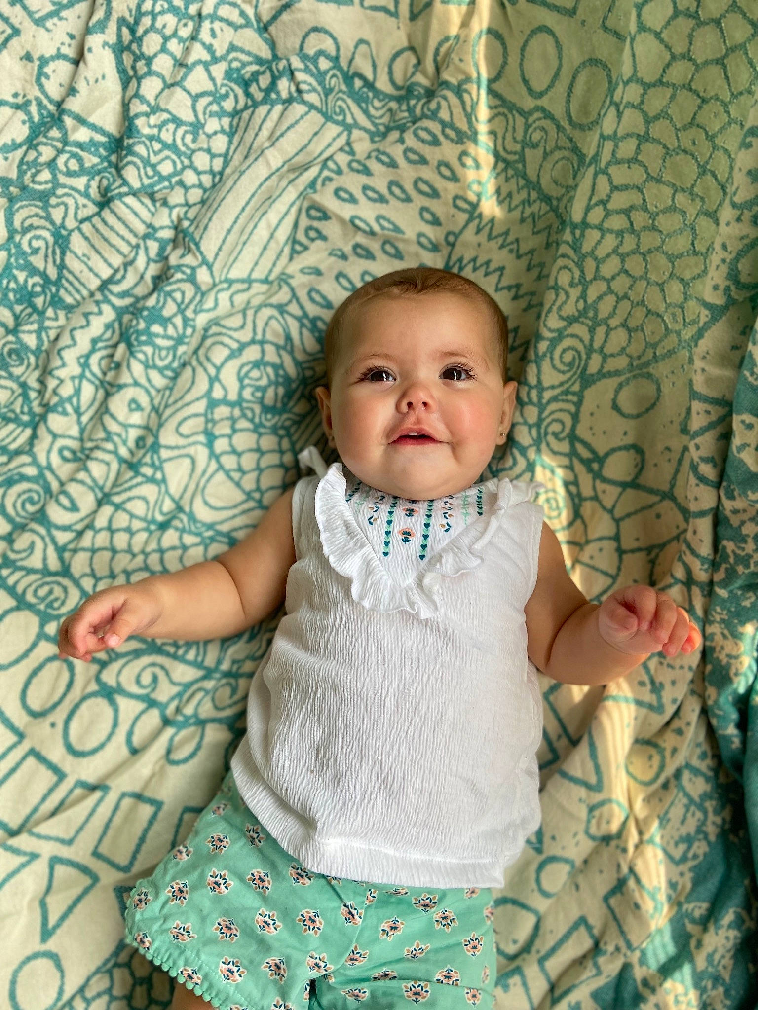Amara is registered to the contest to win money with this photo: aqua, azure, baby, baby_toddler_clothing, blue, child, eye, face, green, happy, iris, person, pink, product, skin, sleeve, standing, t_shirt, textile, toddler