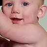baby, child, face, blue_eyes, skin, arm, smile, portrait, indoor, phone_wallpaper, app_icons, user_interface, head, expression, cute, infant, young_child, closeup, human, skin_tone