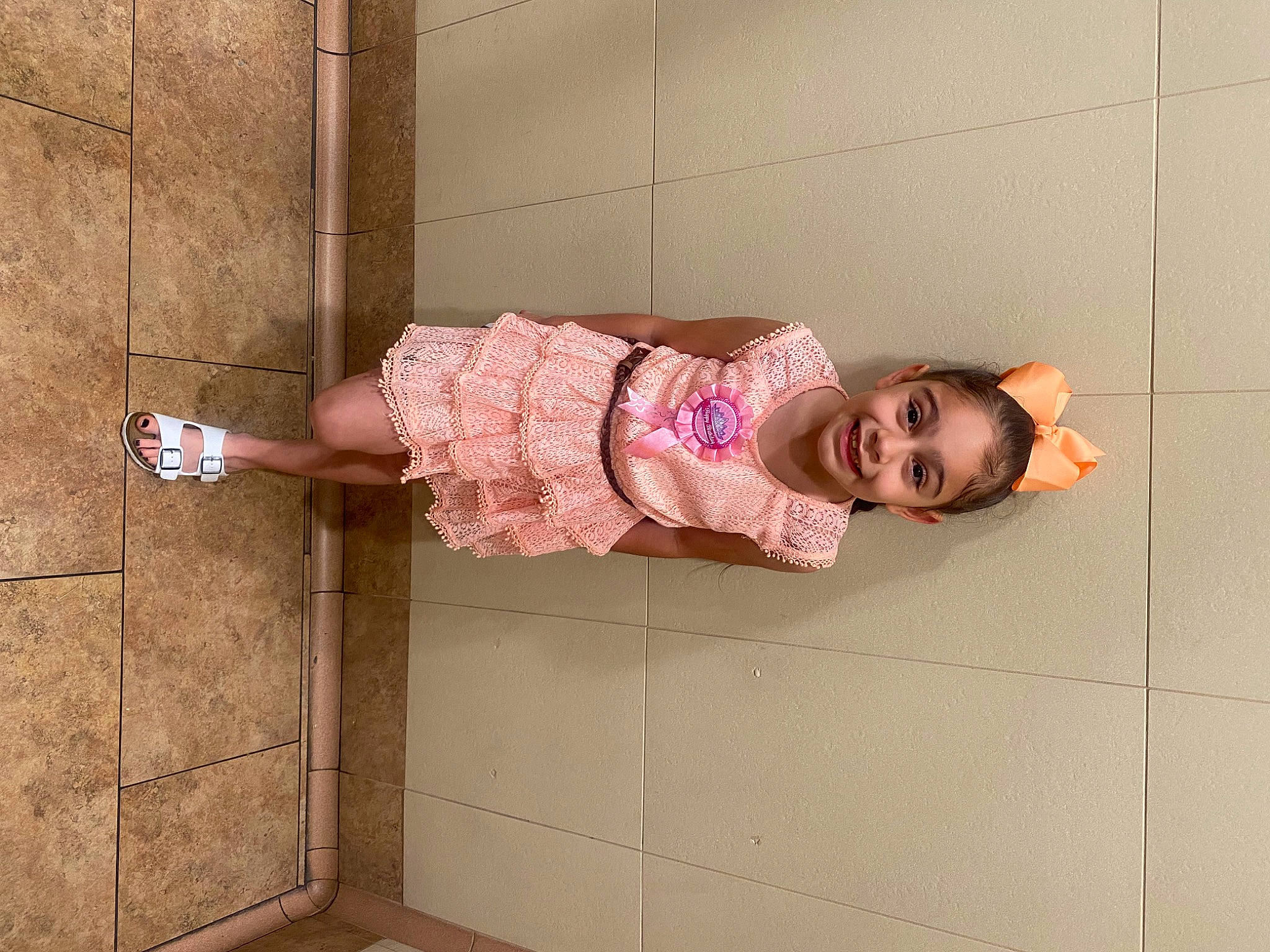 Annaleah joined the competition — help win amazing prizes! baby_toddler_clothing, child, flooring, fun, happy, human_leg, joy, magenta, pattern, person, pink, room, sitting, skin, sleeve, smile, thigh, toddler, wall, wood