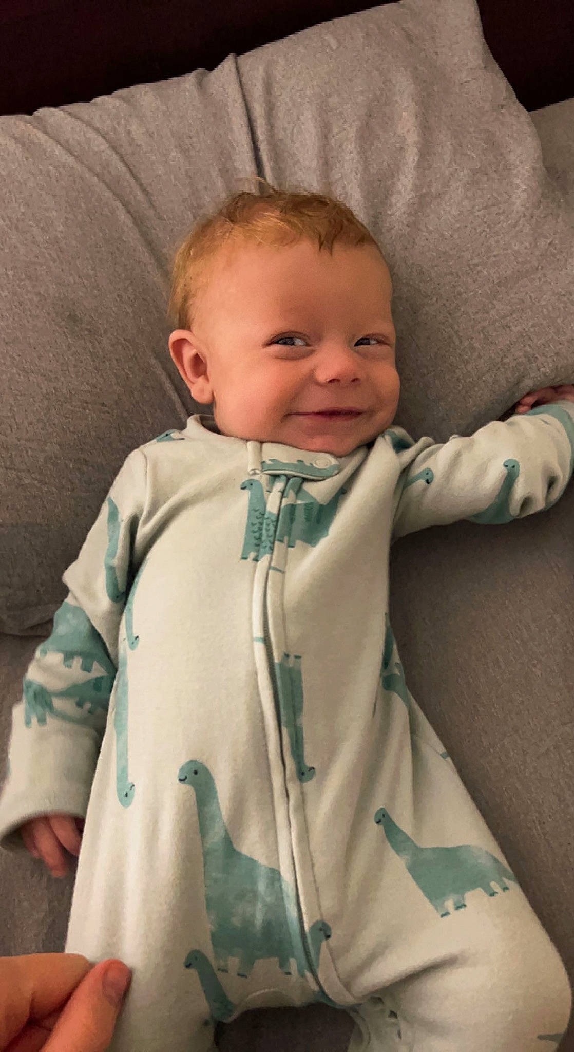 Daxton is registered to the contest to win money with this photo: baby, baby_toddler_clothing, beauty, cheek, comfort, eye, eyebrow, face, gesture, hair, head, human_body, iris, joy, linens, outerwear, person, skin, sleeve, smile
