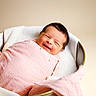 baby, newborn, smiling, wrapped, blanket, pink, basket, cozy, soft, infant, cute, portrait, resting, happy, fabric, warm, child, head, face, sleepy