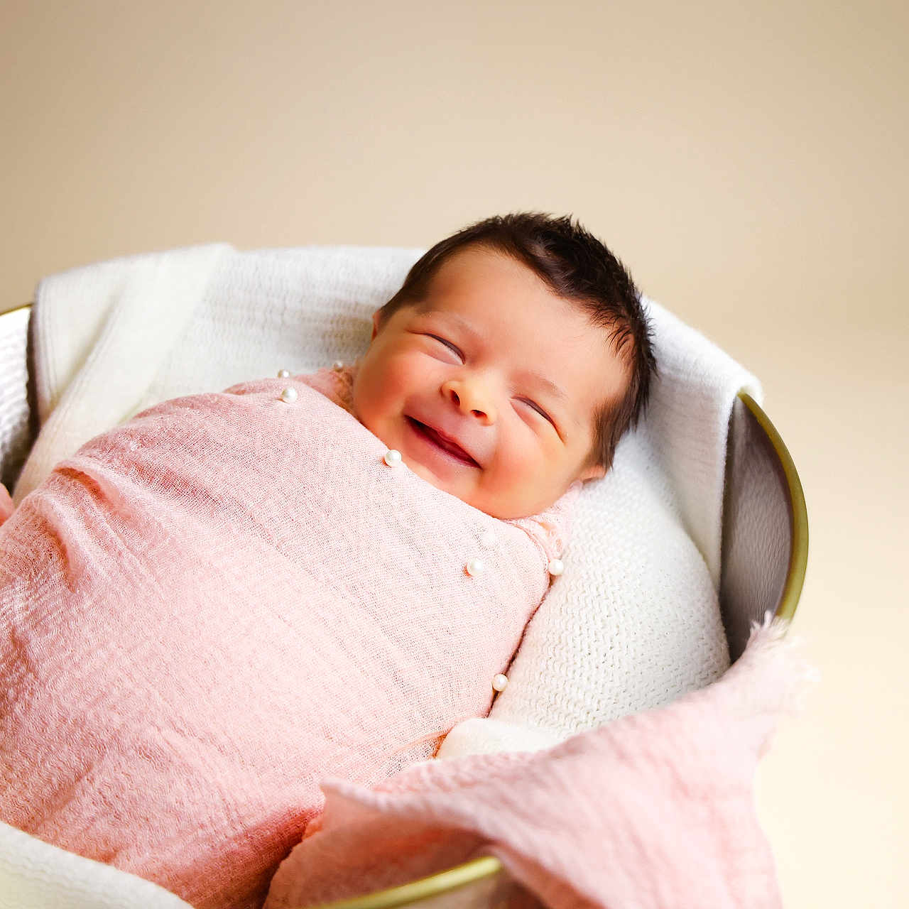 Oakland is registered to the contest to win money with this photo: baby, newborn, smiling, wrapped, blanket, pink, basket, cozy, soft, infant, cute, portrait, resting, happy, fabric, warm, child, head, face, sleepy