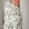 newborn, baby, sleeping, swaddle, floral_pattern, crib, pacifier, infant, cozy, blanket, cute, peaceful, resting, child, bed, soft, head, face, indoors, comfort