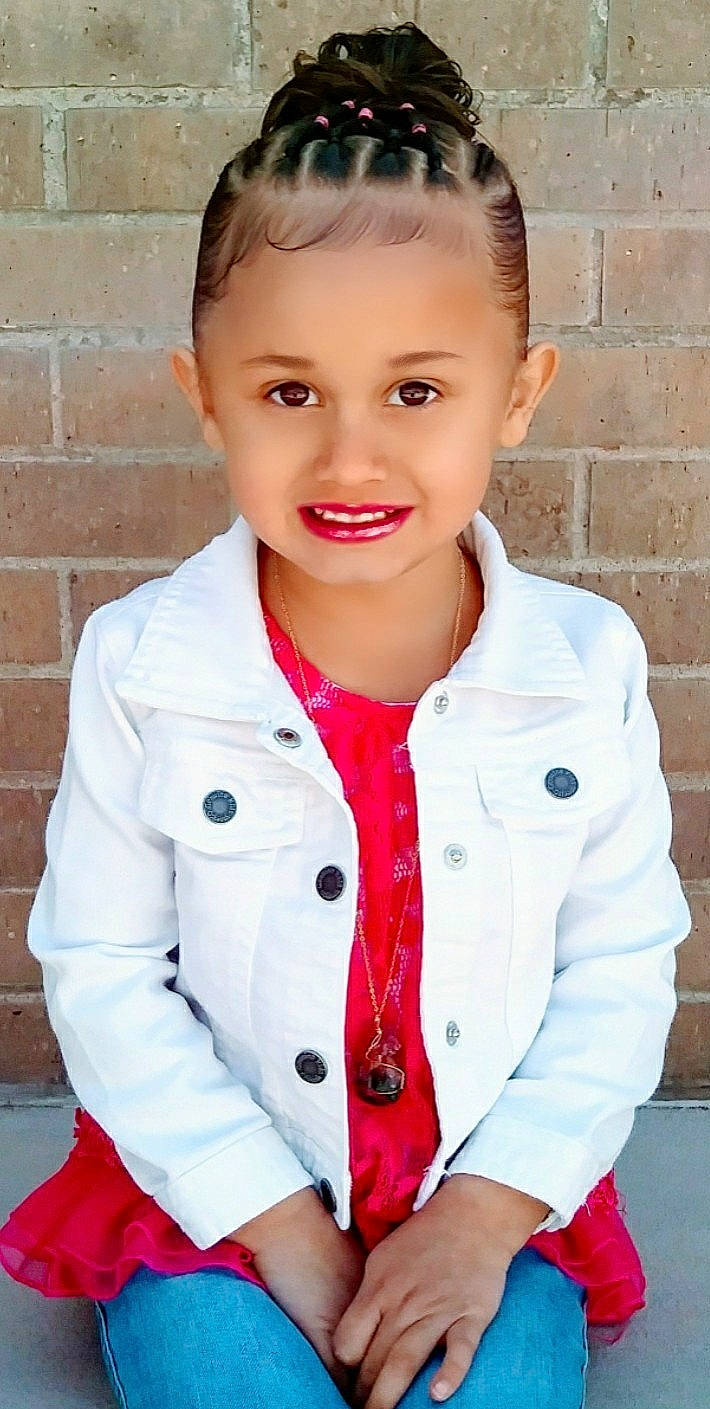 Analysia is registered to the contest to win money with this photo: boy, child, child_model, girl, hair_accessory, hairstyle, joy, outerwear, person, pink, product, skin, sleeve, smile, toddler