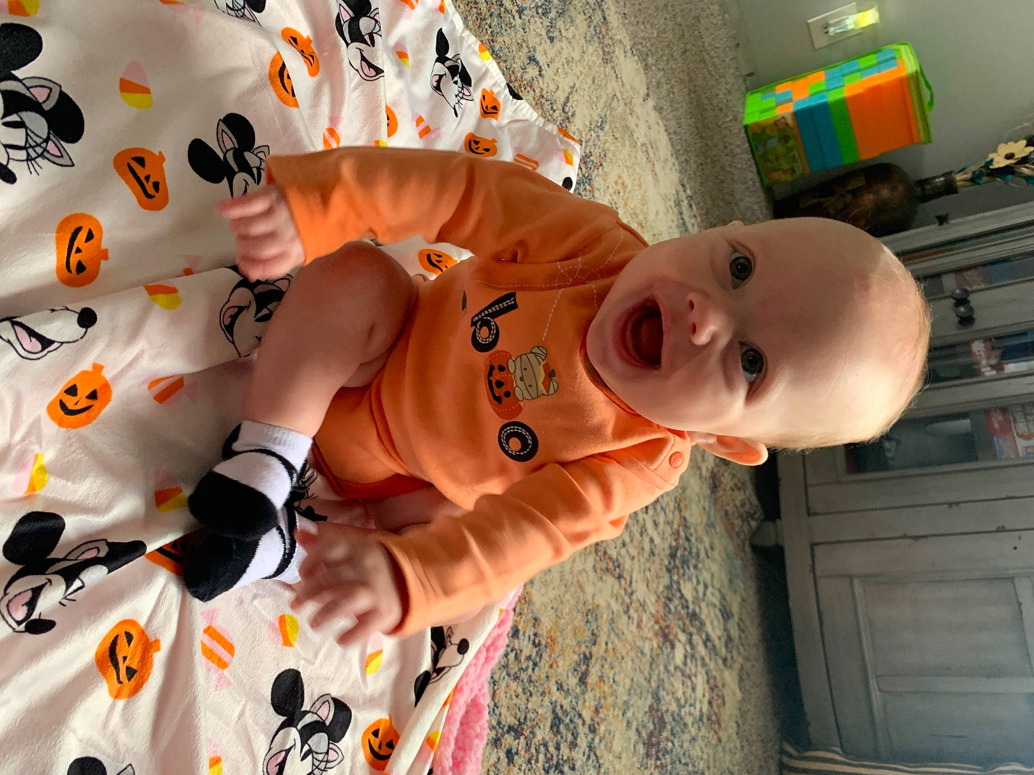 Aubree is registered to the contest to win money with this photo: baby, baby_products, baby_toddler_clothing, child, clothing, event, fun, happy, hat, linens, orange, pattern, people, person, product, room, sleeve, smile, t_shirt, toddler