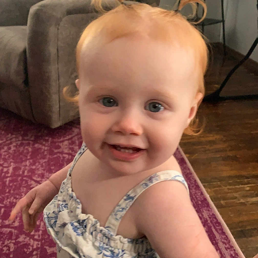 Hadley Ray is registered to the contest to win money with this photo: architecture, baby, building, clothing, couch, cushion, dress, face, furniture, happy, head, homedecor, indoors, interiordesign, livingroom, person, photography, portrait, room, sitting