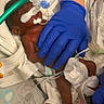 baby, premature_baby, hospital, medical_equipment, gloves, incubator, life_support, tube, sensor, diaper, bed, blanket, care, healthcare, infant, neonatal, person, patient, hand, monitoring