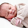 baby, newborn, sleeping, infant, knitted_clothing, cozy, peaceful, cute, hand, face, skin, resting, portrait, closeup, soft, child, person, indoors, blanket, warm