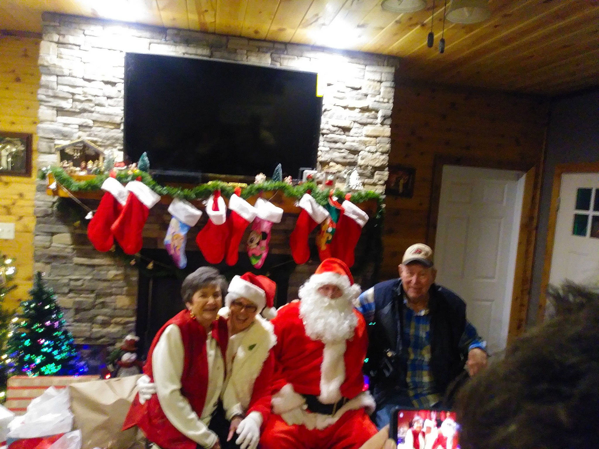 Red is registered to the contest to win money with this photo: christmas, christmas_decoration, event, fete, fun, headwear, holiday, joy, person, recreation, santa_claus, tradition