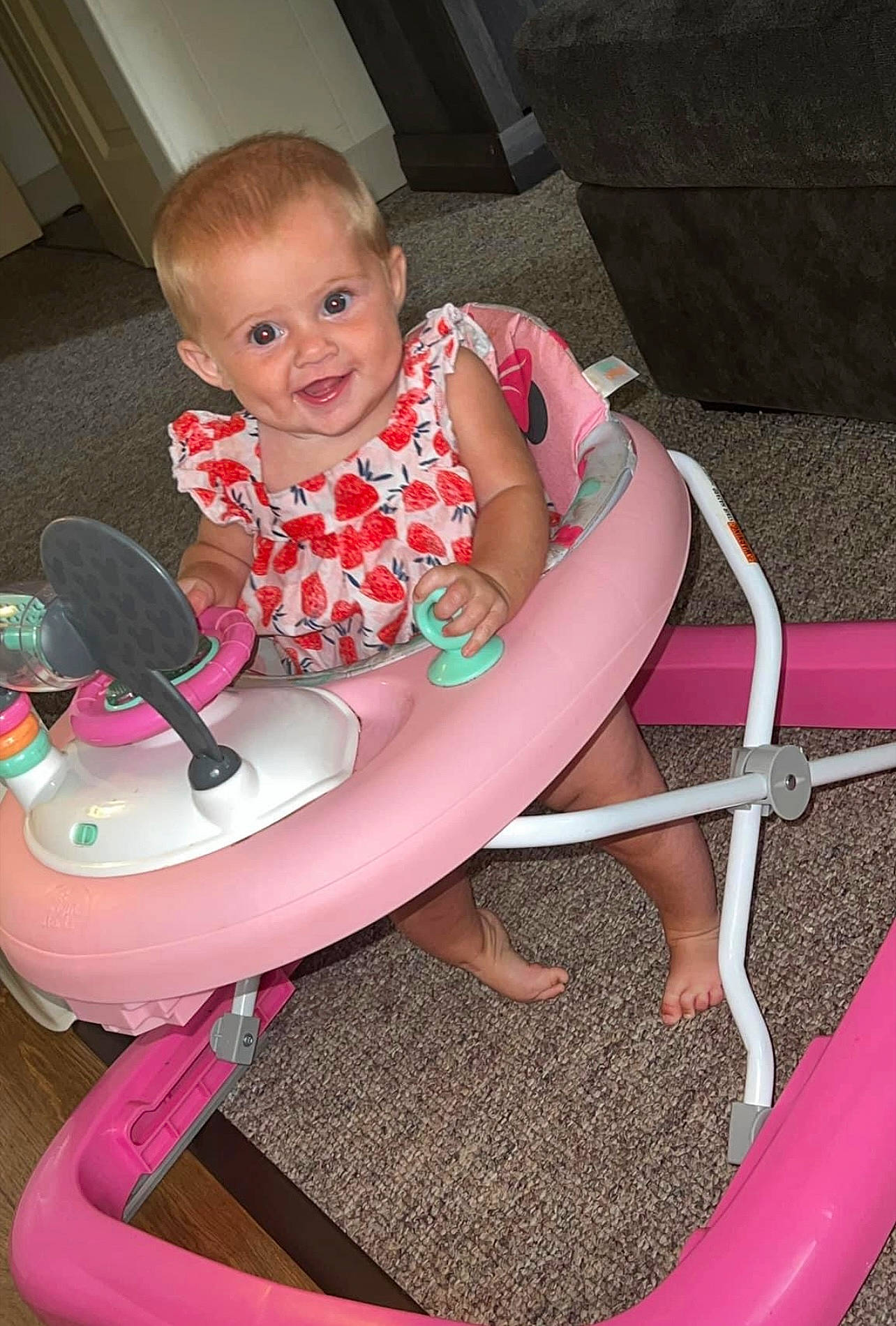 Lakelynn is registered to the contest to win money with this photo: arm, baby, baby_products, baby_toddler_clothing, child, comfort, fun, hairstyle, human_body, joy, leg, leisure, magenta, person, pink, red, smile, sneakers, thigh, tire