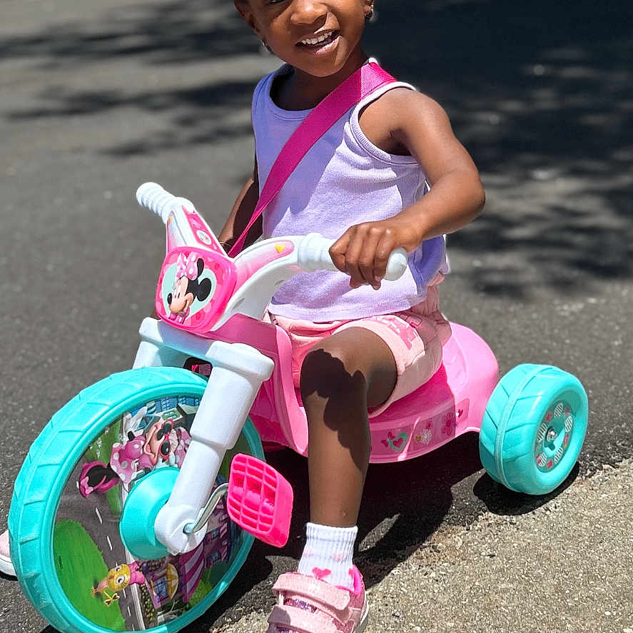 Penelope joined the competition — help win amazing prizes! child, clothing, face, female, footwear, girl, head, machine, person, photography, portrait, shoe, shorts, sitting, sneaker, tire, transportation, tricycle, vehicle, wheel