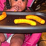 Pryceless joined the competition — help win amazing prizes! baby, child, high_chair, snack, cheese_puffs, food, indoor, curious, face, hand, seatbelt, pink, diaper, young_child, expression, table, tray, person, infant, closeup