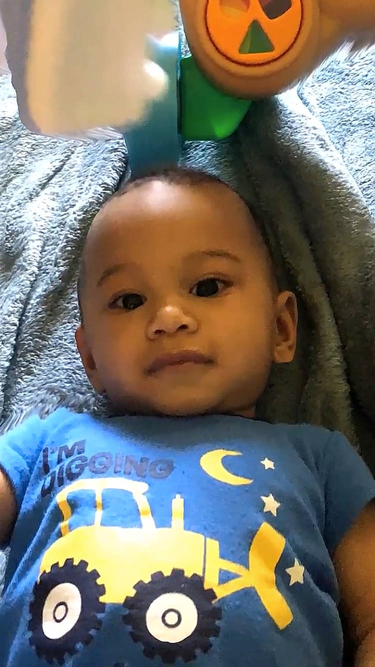 Taron is registered to the contest to win money with this photo: baby, baby_toddler_clothing, cheek, cool, eye, eyebrow, facial_expression, forehead, fun, green, hairstyle, happy, human, nose, organ, person, product, skin, smile, toddler