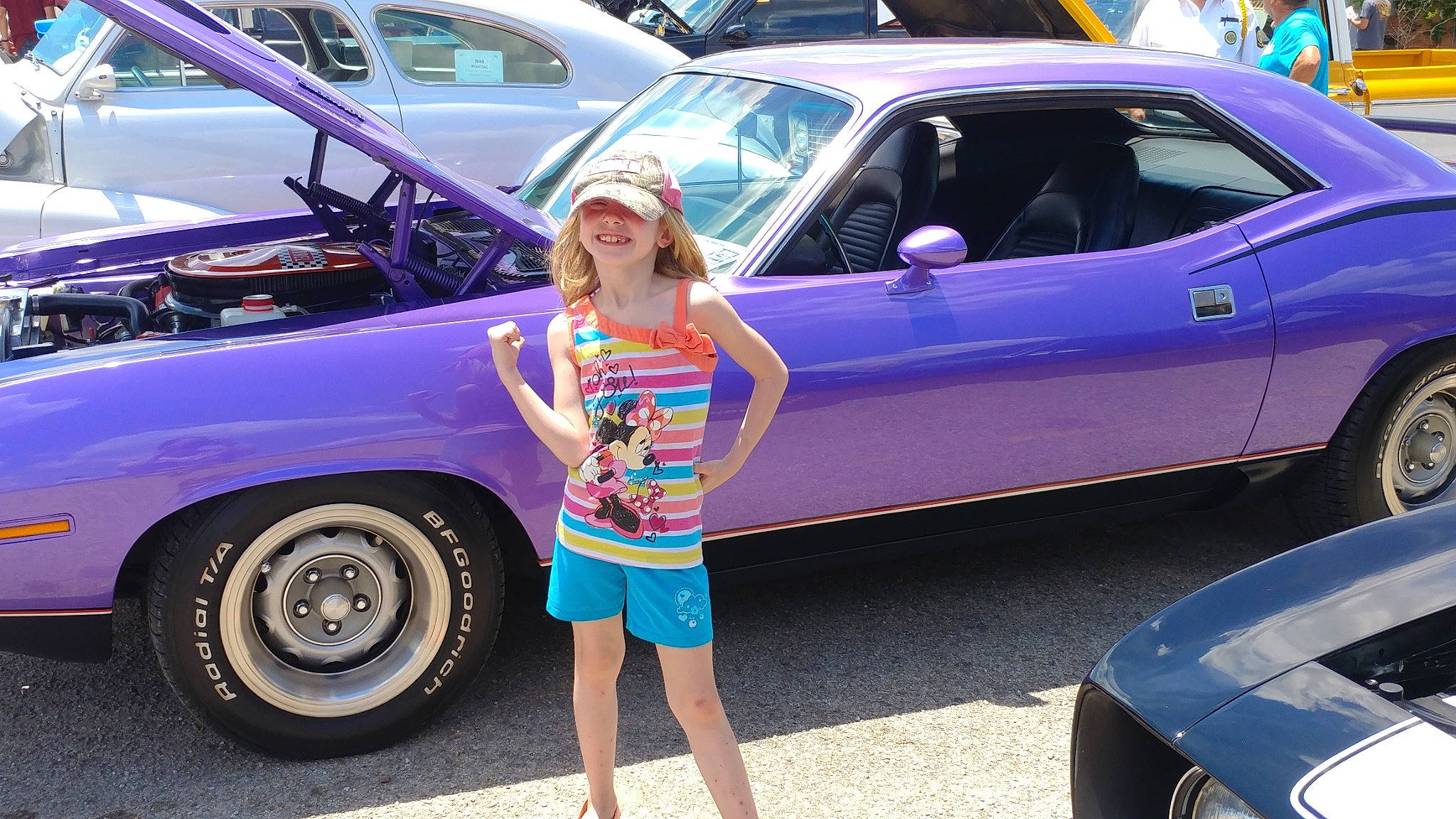 Caylee joined the competition — help win amazing prizes! blue, car, classic, classic_car, coupe, custom_car, electric_blue, full_size_car, hardtop, headwear, hood, joy, land_vehicle, motor_vehicle, muscle_car, person, plymouth_road_runner, sedan, vehicle, vintage_car