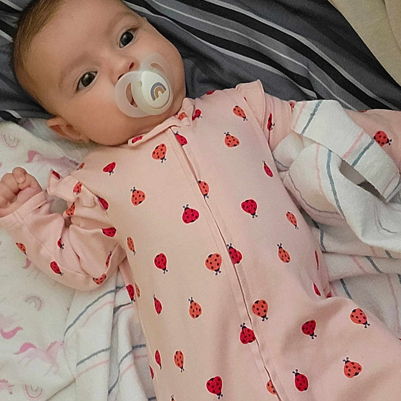 Jacqueline is registered to the contest to win money with this photo: baby, bed, blanket, bodypart, clothing, couch, cushion, face, finger, furniture, hand, head, homedecor, newborn, pajamas, person, photography, portrait, quilt, sleeve