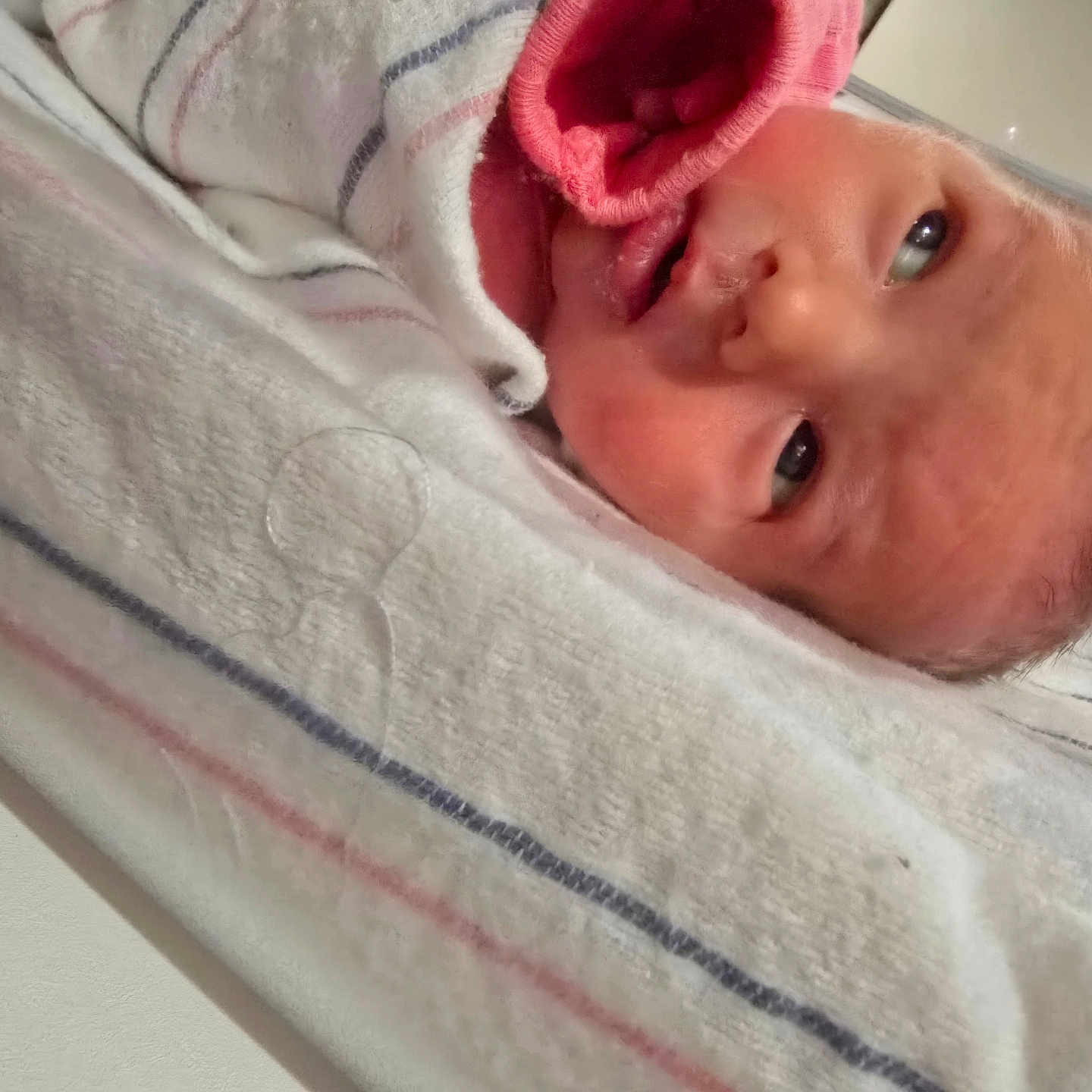 Ariel is registered to the contest to win money with this photo: accessories, architecture, baby, bed, blanket, bodypart, building, earring, face, finger, furniture, hand, head, hospital, newborn, person, photography, portrait, quilt, towel