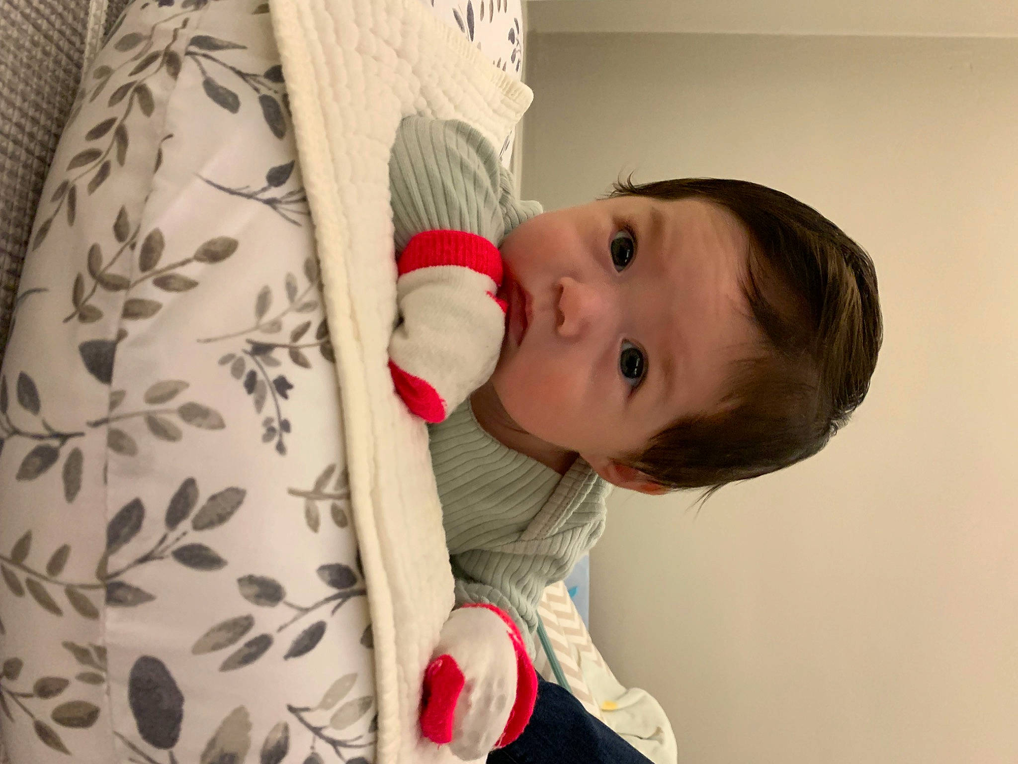 Claire is registered to the contest to win money with this photo: baby, baby_toddler_clothing, carmine, cheek, child, comfort, face, flooring, happy, head, human_body, iris, linens, lip, mammal, nose, pattern, person, sleeve, toddler